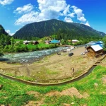 Lush green meadows and snow peaks in Gulmarg Kashmir thumbnail